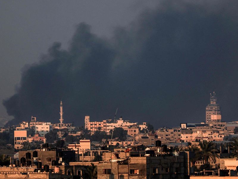 A picture taken from Rafah shows smoke from Israeli bombardment covering the skyline of Khan Yunis in the southern Gaza Strip on December 29, 2023, amid ongoing battles between Israel and the militant group Hamas.
