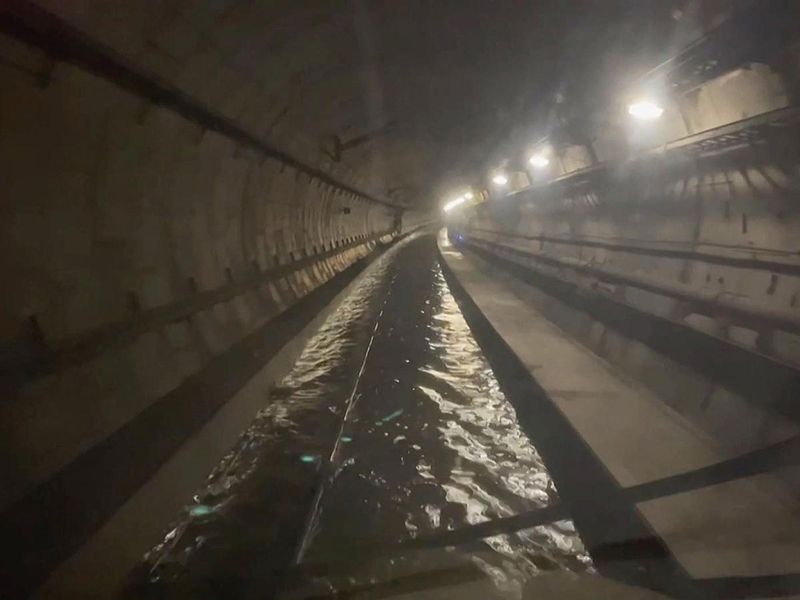 A frame grab taken from a handout video footage posted on the Southeastern Railway's X account on December 30, 2023  shows flooded water in a tunnel used by Eurostar trains, near Ebbsfleet International station in Kent, southern England.  