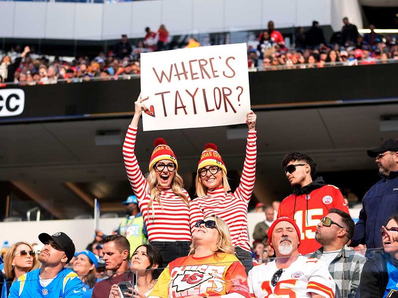 Kansas City Chiefs fans hold a sign for singer Taylor Swift during the first half of an NFL football game against the Los Angeles Chargers, Sunday, Jan. 7, 2024, in Inglewood, Calif.
