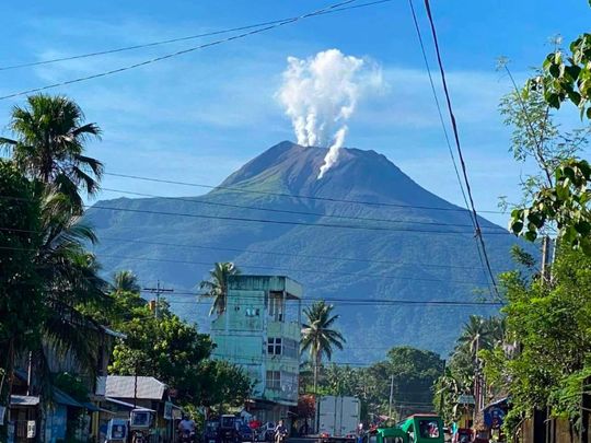 In this photo shared by Philvolcs, Mount Bulusan Volcano spews ash as seen from Juban township, in Sorsogon province