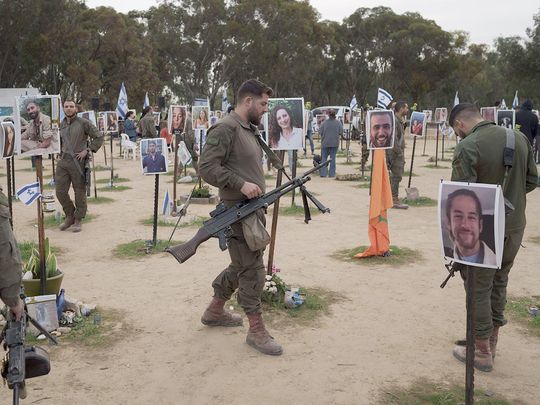 Israeli soldiers visit the site where revellers were killed on October 7