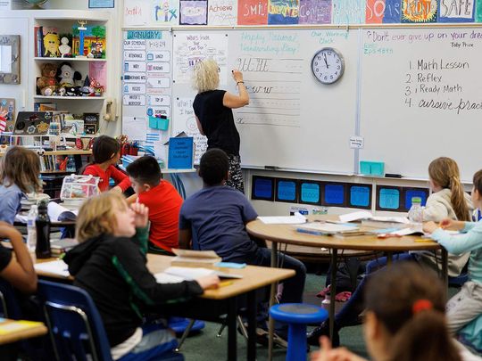 Upper multi-aged teacher of grades 4 to 6 at Orangethorpe Elementary School, Pamela Keller, teaches students cursive writing at Orangethorpe Elementary School, in Fullerton, California, U.S. January 23, 2024.