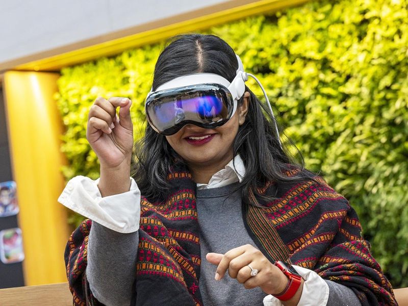 A customer with an Apple Vision Pro mixed reality (XR) headset at the company's store in Palo Alto, California. 