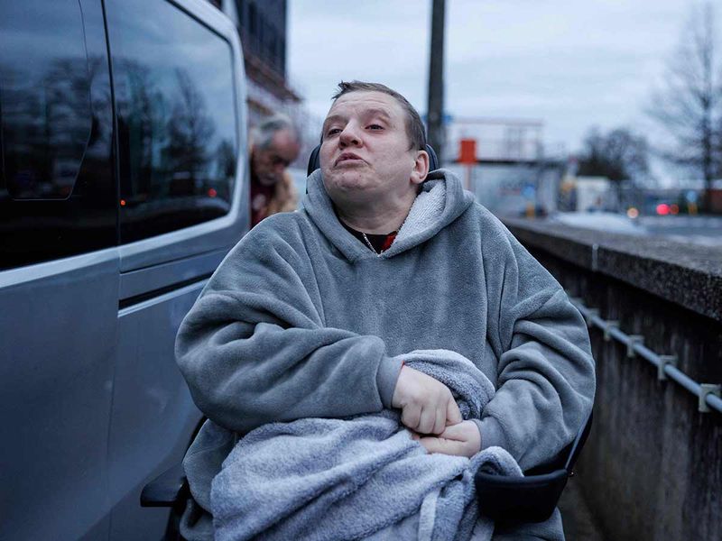 Lydie Imhoff sits in her wheelchair as she arrives at the hospital in Belgium, on January 31, 2024. 