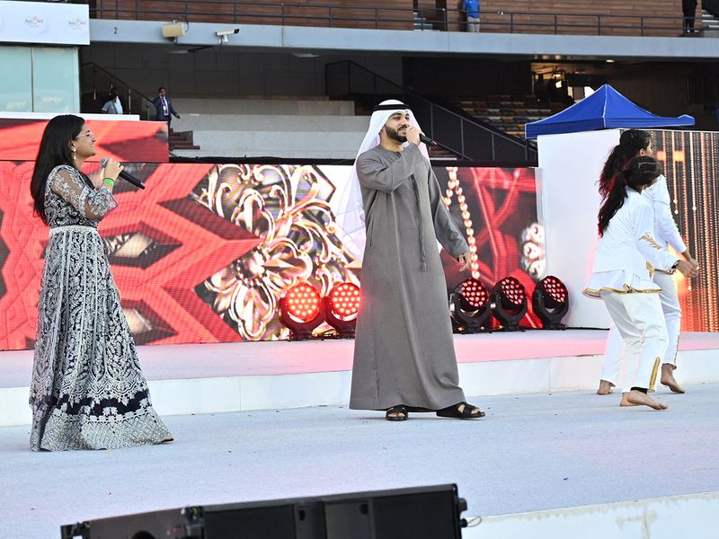 Ghaith Al Hayem (centre) and Suchetha Satish (left) during their performance at Ahlan Modi event