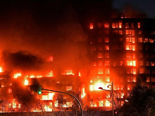 A huge fire rages through a multistorey residential block in Valencia on February 22, 2024. 