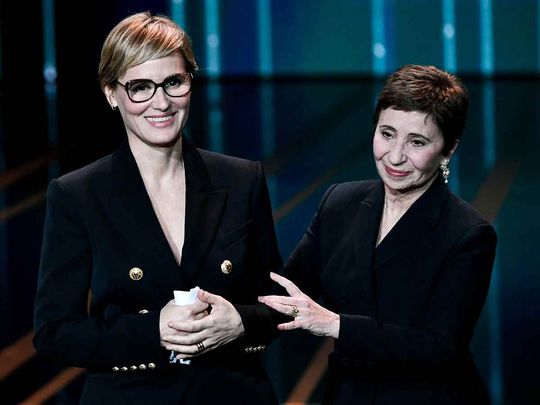 French actress Judith Godreche (L) speaks next to French actress and Mistress of Ceremony Ariane Ascaride during the 49th edition of the Cesar Film Awards ceremony at the Olympia venue in Paris on February 23, 2024. 
