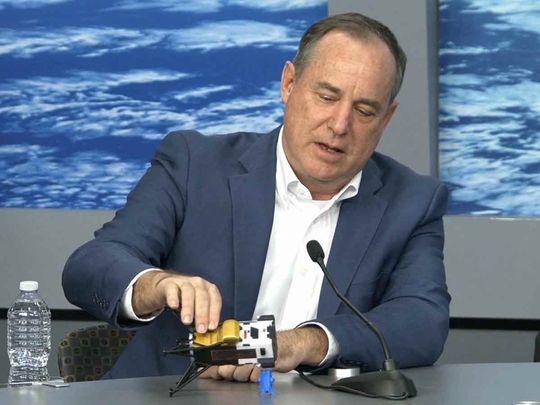 This frame grab from Nasa, shows Intuitive Machines CEO Steve Altemus holding a model of Odysseus to show its position on the side during a press conference at Johnson Space Center in Houstom, Texas on February 23, 2024. 
