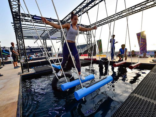 File picture of participants trying their hands at the Iron Grip obstacle during a media preview of a previous edition Government Games at Kite Beach in Dubai Virendra Saklani/Gulf News