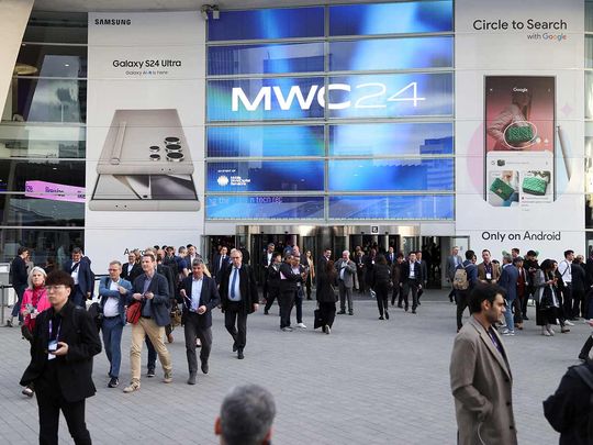 People exit the Mobile World Congress (MWC) in Barcelona, on February 27, 2024. 