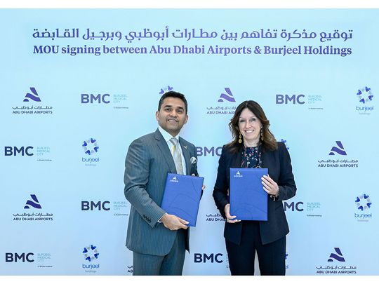 Dr. Shamsheer Vayalil and Elena Sorlini exchanging MoUs to streamline healthcare for passengers at Zayed International Airport