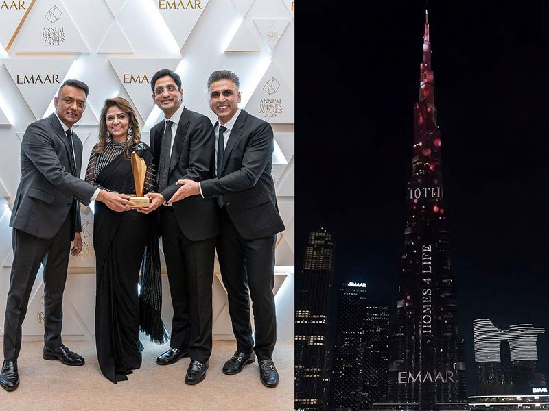 Homes 4 Life Managing Partners (Paresh Kamlani, Deepti Gehani, Nitin Giyanani & Jai Sajnani) with the award & Burj Khalifa displaying their Company name