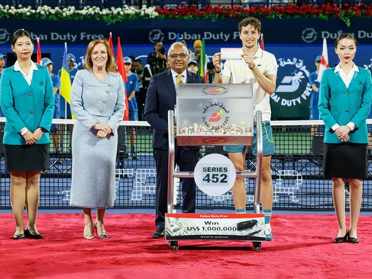 Dubai-Duty-Free-Tennis-Championships-winner-Ugo-Humbert-with-Dubai-Duty-Free-officials-conducted-the-draw-for-Dubai-Duty-Free-Millennium-Millionaire-Series--452-1709454364990