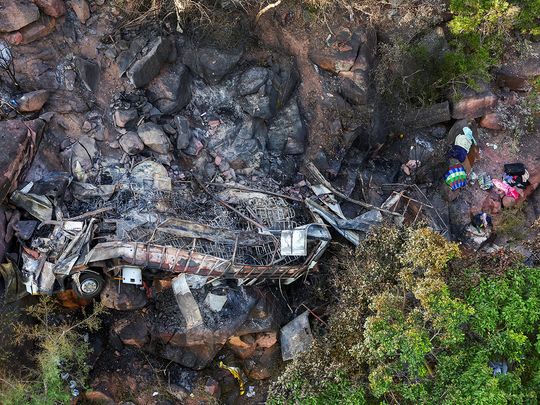 A view of the burnt remains of the bus that was taking Easter pilgrims from Botswana to Moria, following its crash near Mamatlakala in the northern province of Limpopo, South Africa March 29, 2024. 