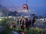 Members of Turkey's Disaster Management Authority (AFAD) take part in a rescue operation after a cable car cabin collided with a broken pole, in Antalya, Turkey. 