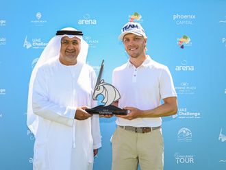Aref Al Awani, Secretary General of Abu Dhabi Sports Council, poses with Maximilian Rottluff of Germany, the winner of the 2023 UAE Challenge