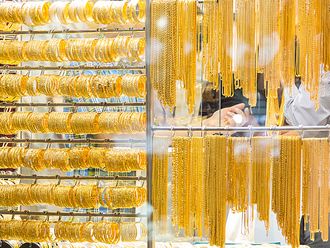 Gold prices hit record high, tops $2,500 an ounce