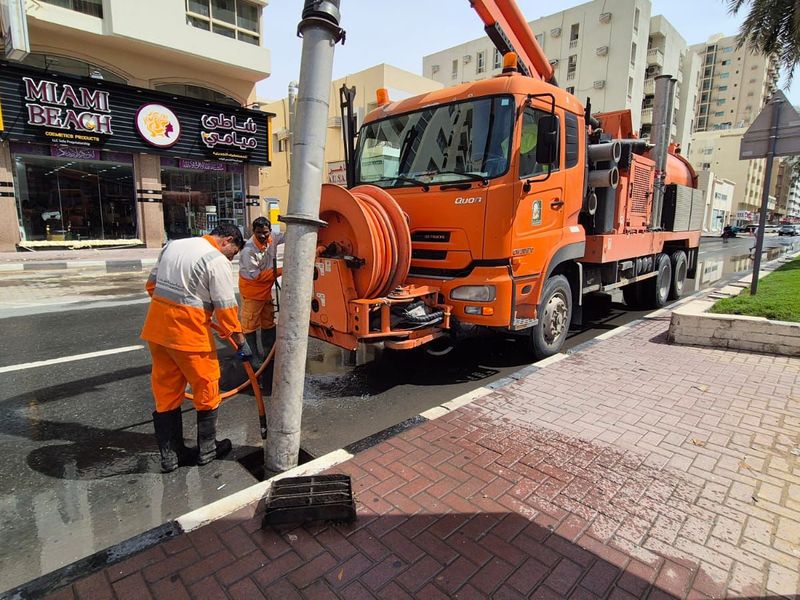 Sharjah municipality workers RAIN