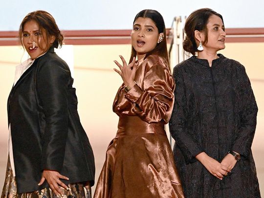 From left: Indian actress Chhaya Kadam, Indian actress Divya Prabha and Indian director Payal Kapadia arrive for the screening of the film 