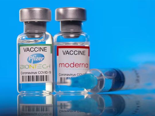 Vials with Pfizer-BioNTech and Moderna coronavirus disease (COVID-19) vaccine
