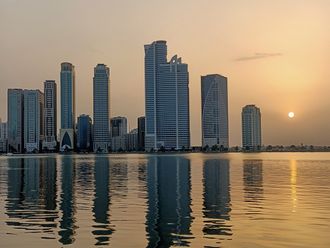 A sunset view from Khalid Lagoon in Buhaira Corniche, Sharjah. Sharjah skyline