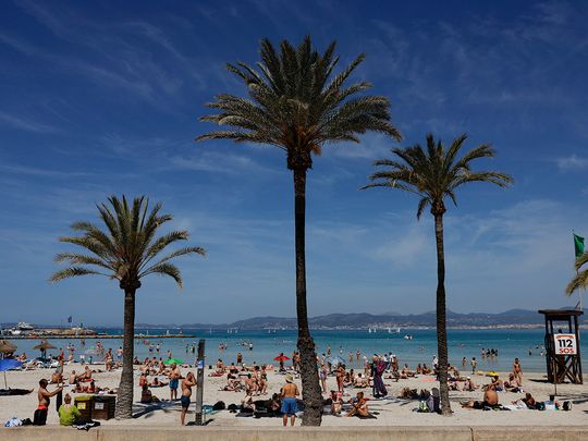 Tourists at the El Arenal beach in Palma de Mallorca, Spain.  