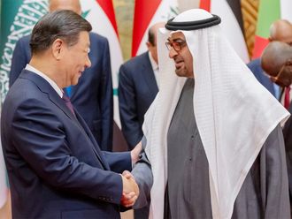 His Highness Sheikh Mohamed bin Zayed Al Nahyan, President of the United Arab Emirates (right) greets His Excellency Xi Jinping, President of China (left), during the China-Arab States Cooperation Forum, at Diaoyutai State Guesthouse.  