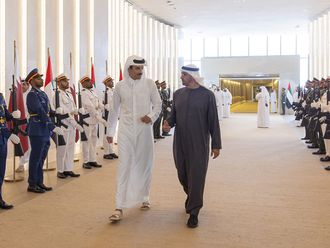 President His Highness Sheikh Mohamed bin Zayed Al Nahyan (R) and Emir of Qatar Sheikh Tamim bin Hamad Al Thani