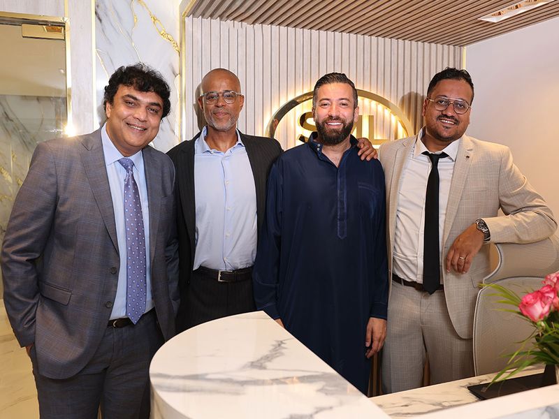 Dharmesh Narendra Sangani, Director of Logistics (extreme left), Patrick Laurent N’dom, Incharge of the Financial Division (middle left), Fayçal Lalioui, founder and chairman (middle right), and Prasanna Muthulingam, Director of Internal Operations (extreme right).