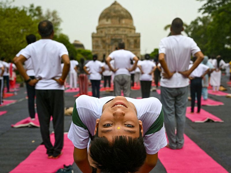 People take part in a yoga session at Lodhi gardens on International Day of Yoga, in New Delhi