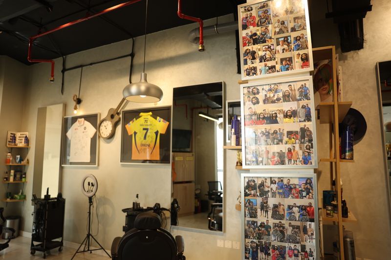 Photos with celebrity cricketers displayed at Salmani's salon.