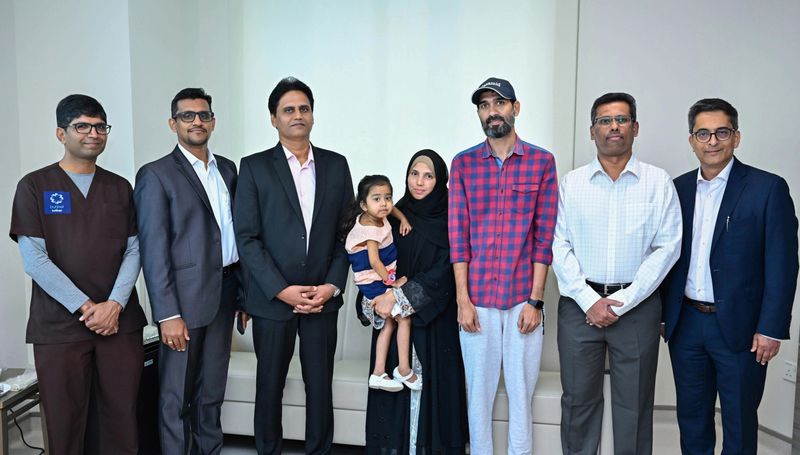Razia Khan, the UAE's first pediatric liver transplant recipient, and her family with the medical team at Burjeel Medical City-1720588722285