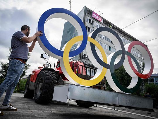 Olympic rings are being installed in front of the Nantes train station in Nantes 