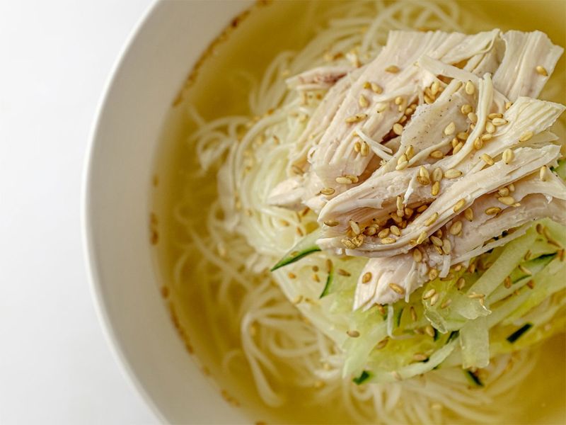 Chogyeguksu traditionally uses somyeon (소면), thin Korean noodles made from buckwheat flour.