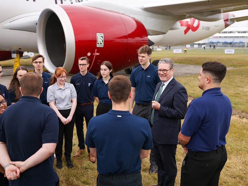 Keir Starmer, UK prime minister, second right, meets apprentices from Airbus SE, during the opening day of the Farnborough International Airshow in Farnborough, UK, on Monday, July 22, 2024. The aviation summit is typically a platform for planemakers to rack up multibillion-dollar deals. 