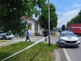 Police cars are stationed in front of a care home where at least six people were killed in a shooting in Daruvar, some 130km from Zagreb 