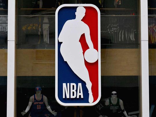 The NBA logo is seen outside an NBA fan store in New York