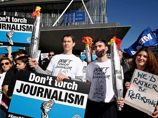 Journalists from The Age newspaper protest outside their offices in Melbourne 