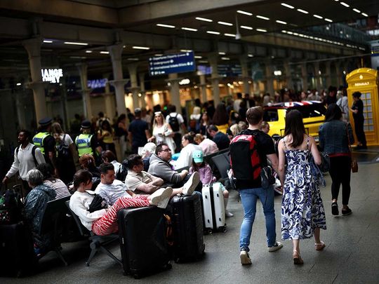 Passengers wait in the seating area of St Pancras International in central London on July 26, 2024.