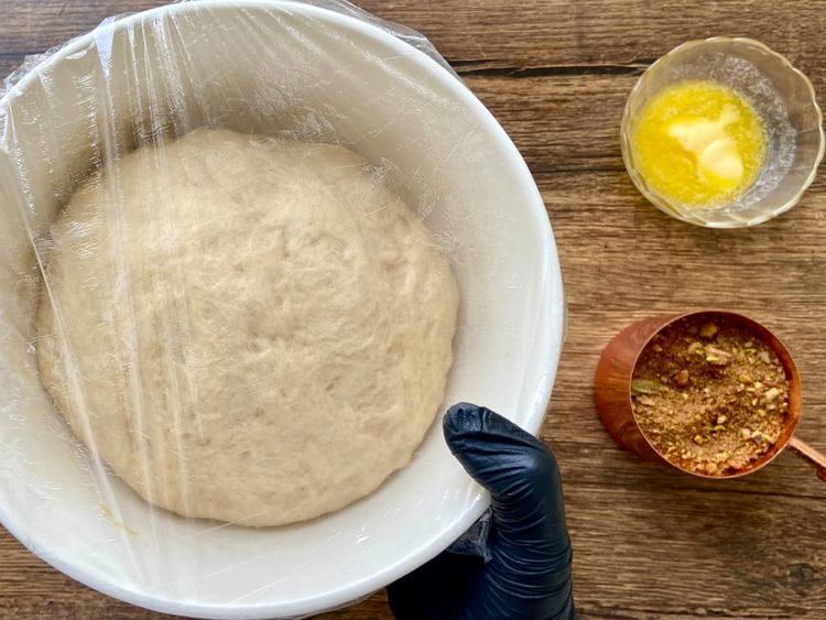 Place the dough in a bowl, cover it with plastic wrap, and let it proof in a warm place for 1 to 2 hours until it doubles.