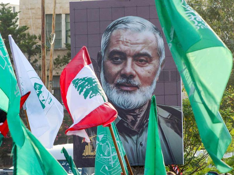 A portrait of slain Hamas leader Ismail Haniyeh is displayed during a demonstration