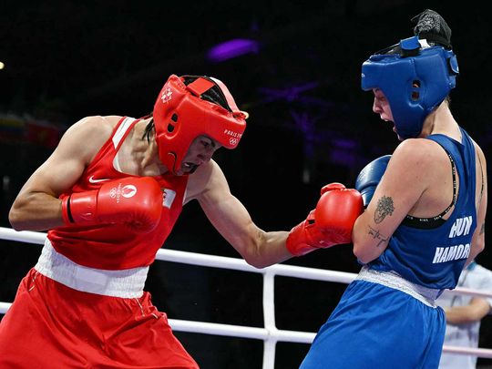 Algeria's Imane Khelif (left) fights against Hungary's Anna Luca Hamori