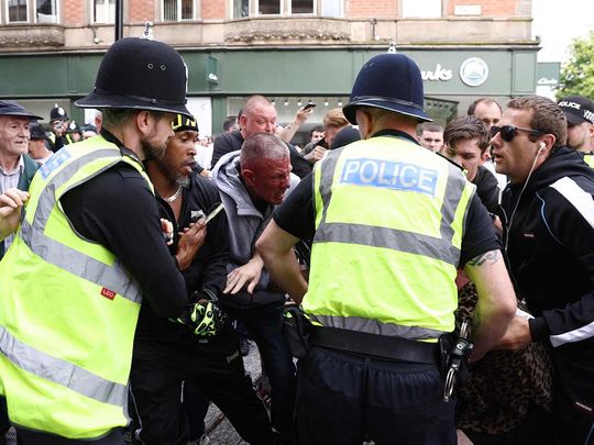 Protesters and counter-protestors scuffle in Nottingham