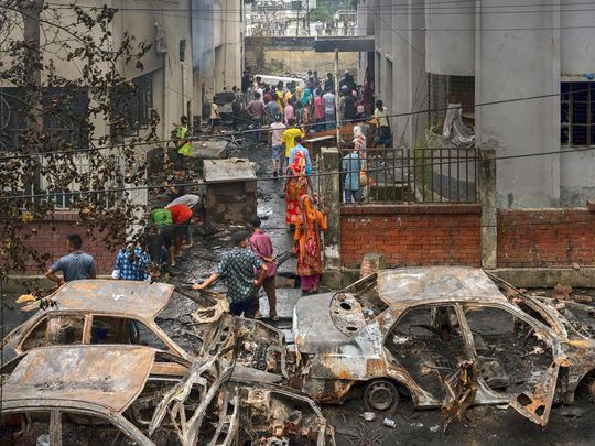 Damaged vehicles following a protest in Dhaka