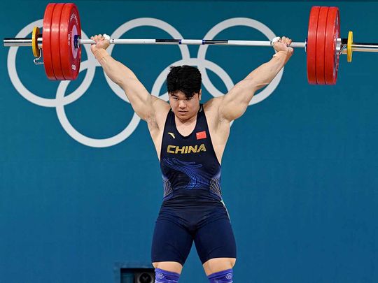 China's Liu Huanhua competes in the men's -102kg weightlifting event