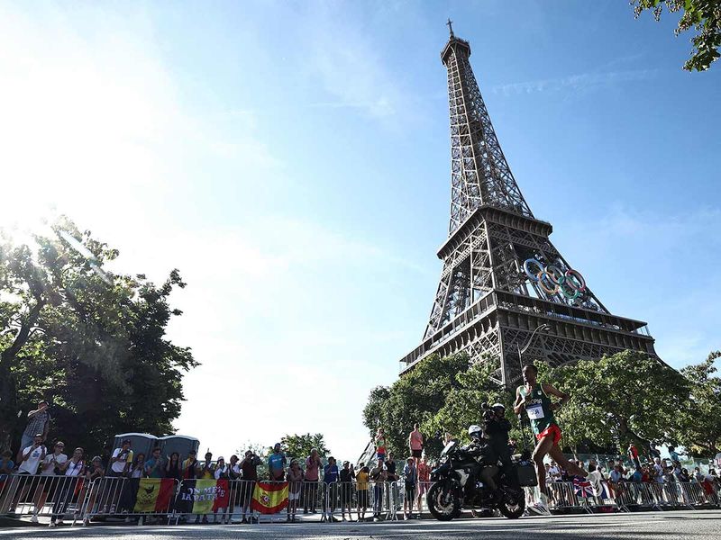 Ethiopia's Tamirat Tola runs past the Eiffel Tower 