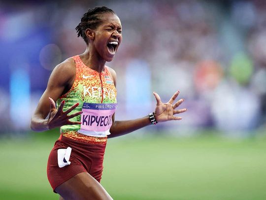 Gold medallist Kenya's Faith Kipyegon reacts