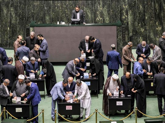 Members of the Iranian parliament vote on the cabinet appointments