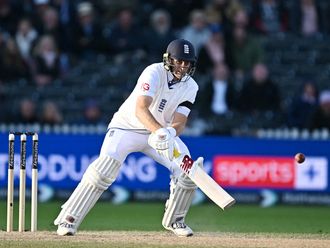 England's Joe Root attempts a scoop shot 