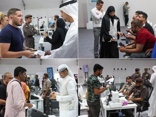 Amnesty seekers being assisted by GDRFA officials at the Al Awir centre in Dubai on Sunday